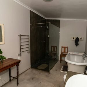 a bathroom with a tub sink and toilet